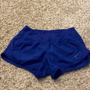 Dark blue nike running shorts